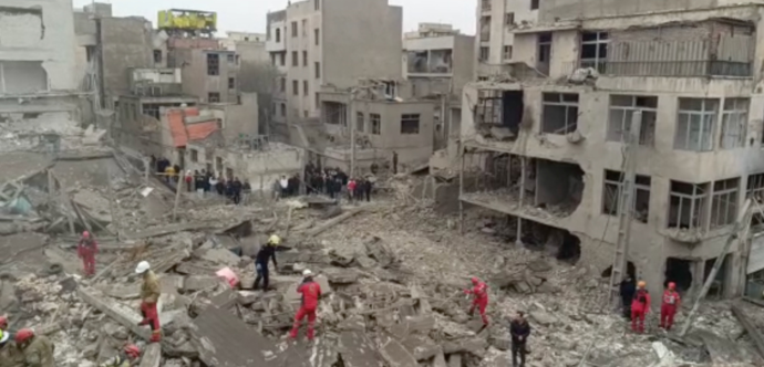 Still from a video that shows parts of the police station in Javadieh destroyed, as well as destruction and damage to other surrounding buildings in Ghorbani street